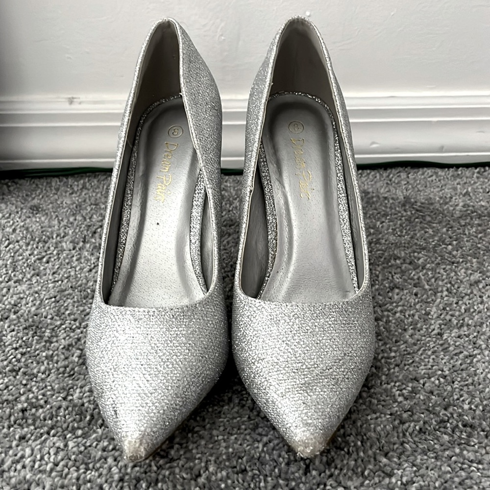 Women’s size 8 silver heels.